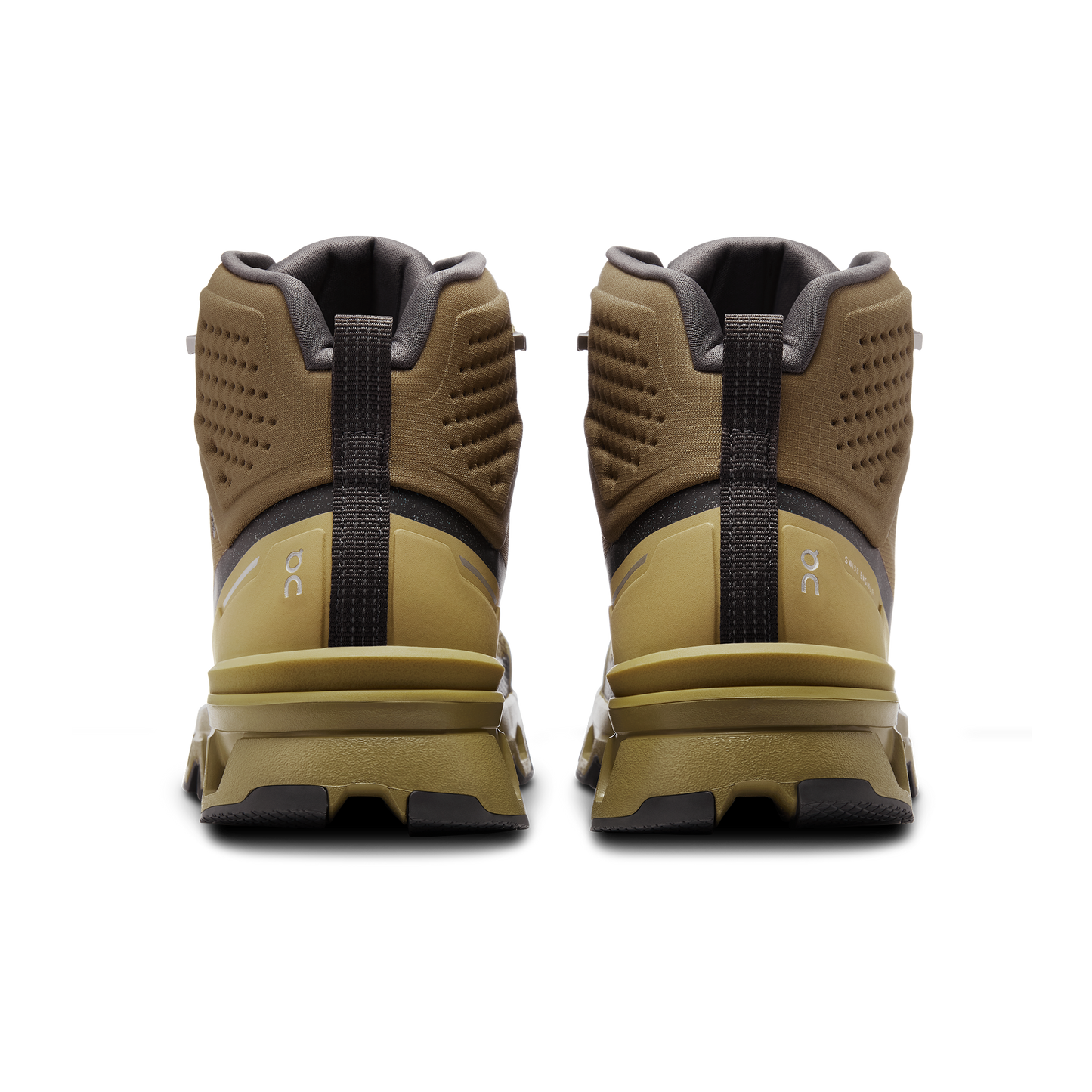 Viewed from the back against a black background is a pair of Women's Cloudrock 2 Waterproof shoes by On Running, featuring brown and yellow colors, designed for speed-hiking.