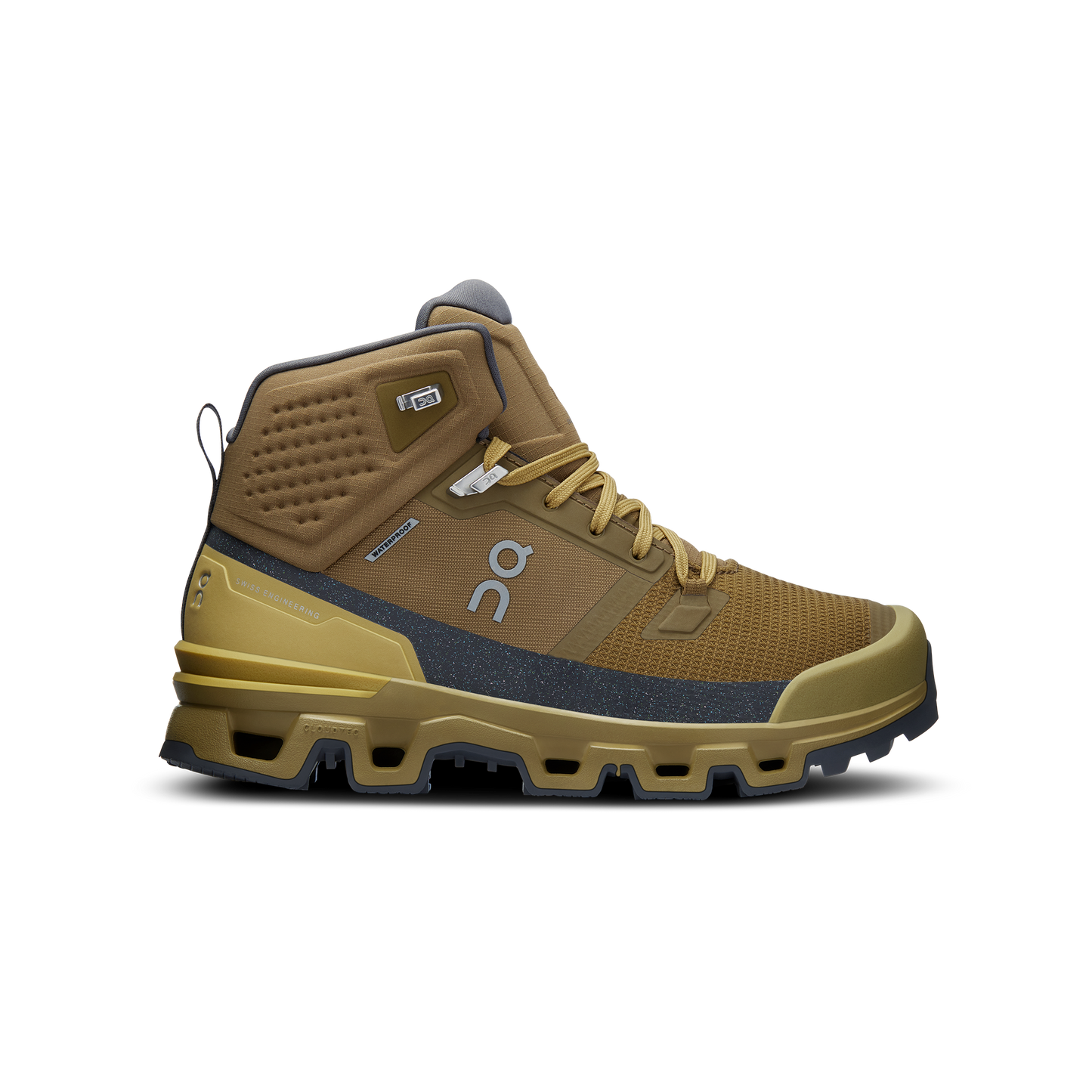 An On Running Women's Cloudrock 2 Waterproof speed-hiking boot in tan and gray, showcasing shock absorption, visible treads, and a lace-up design, set against a black background.