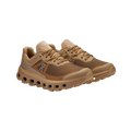 Men's Cloudvista 2 by On Running: An angled view of brown sports shoes with a mesh design, showcasing the exclusive Helion™ superfoam midsole for enhanced comfort and a cushioned sole.