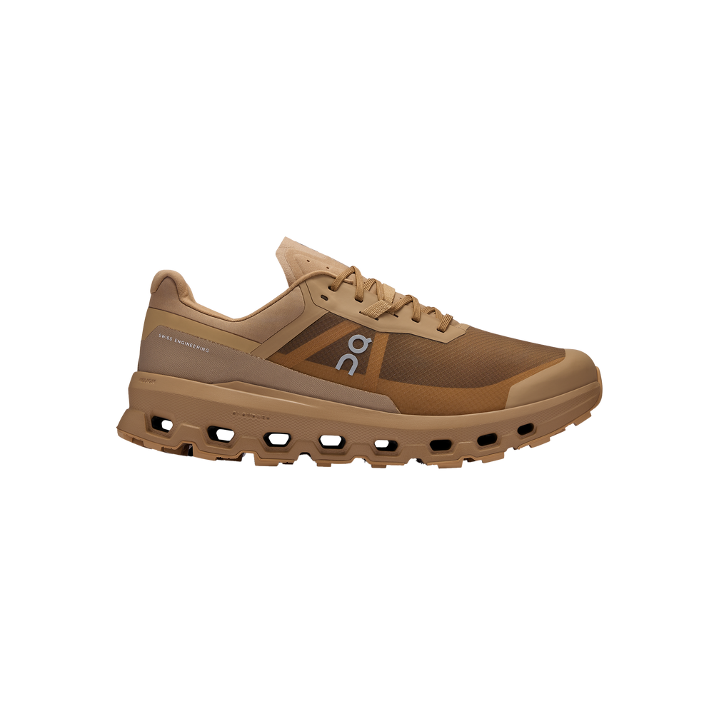 Introducing the Men's Cloudvista 2 trail running shoe by On Running, featuring a brown color, a thick Missiongrip™ outsole with ridges for excellent traction, and a branded logo on the side. It is equipped with a Helion™ superfoam midsole for exceptional comfort.