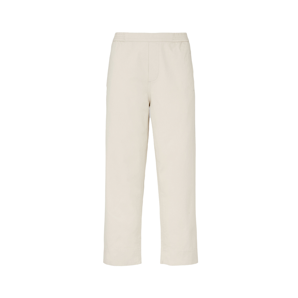 The Coco Pant Twill by Aiayu is a classic straight-fit beige trouser made from GOTS-certified organic cotton twill with an elastic waistband, shown on a plain background.