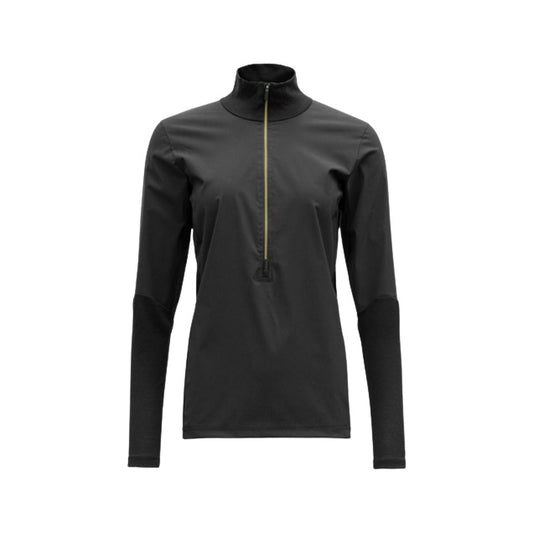 The Devold® W Running Cover Zip Neck, Caviar features a black long-sleeve design with a green zipper and high collar. Ideal as a running outer layer, it pairs perfectly with Devold® Running Cover Pants for those who value style and functionality in wind-resistant clothing against a plain white backdrop.