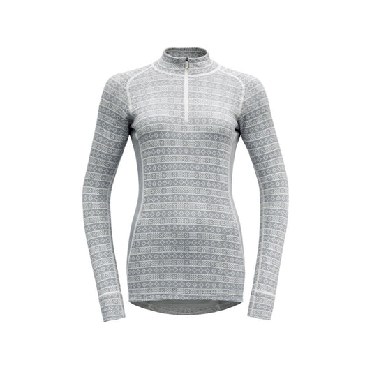 The W Alnes Half Zip Neck by Devold is a gray long-sleeve athletic shirt with white geometric patterns, crafted from Merino wool. This multifunctional baselayer offers a quarter-zip front for versatile wear in various settings.