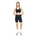 A person wearing Rohnisch's Flattering High Waist Bike Tights in black, paired with white sneakers, stands against a clear background. The tights are made from recycled polyester.