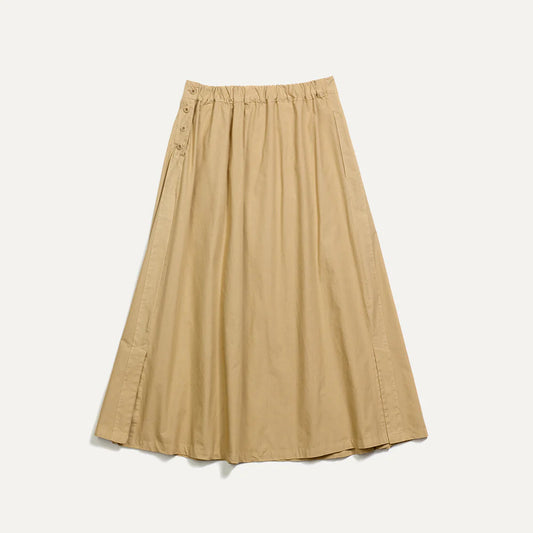 The Gonna John Kimbo Skirt by Labo Art, in the Mojave colorway, is a beige, knee-length skirt featuring an elastic waistband and button details on the left side.