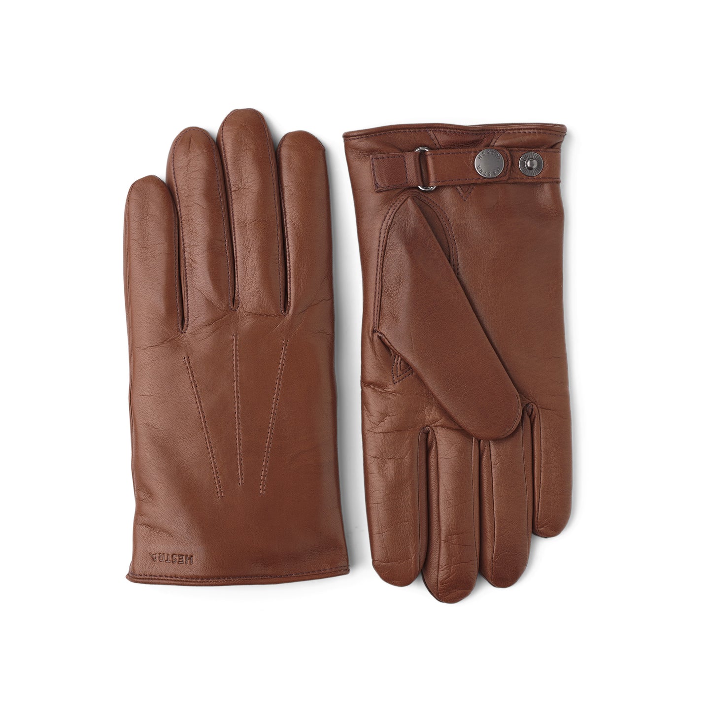 The Nelson Chestnut gloves by Hestra, crafted from Italian lamb nappa leather, showcase a buttoned strap detail. One glove is shown flat while the other reveals its palm side. These exquisite gloves feature a luxurious wool lining for added warmth and comfort.