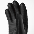 The Jeanne glove in black by Hestra features Italian lamb nappa leather with textured polyamide fabric on the finger sides, displayed against a plain white background.