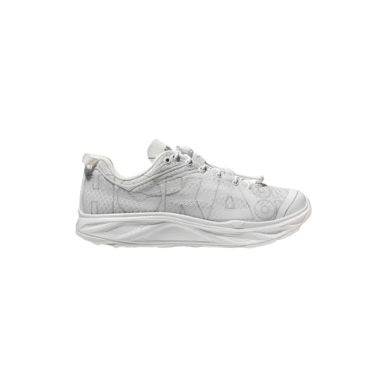 Side view of the Hoka U Huaka Origins in white, an athletic shoe with a patterned design, laces, and a textured sole inspired by Hoka's cushioned ride.