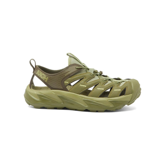 The Hoka U Hopara in Forest Floor/Fennel is an olive green outdoor hiking sandal featuring a cut-out design, a sticky rubber outsole for superior grip, a thick sole, and a front pull-loop.