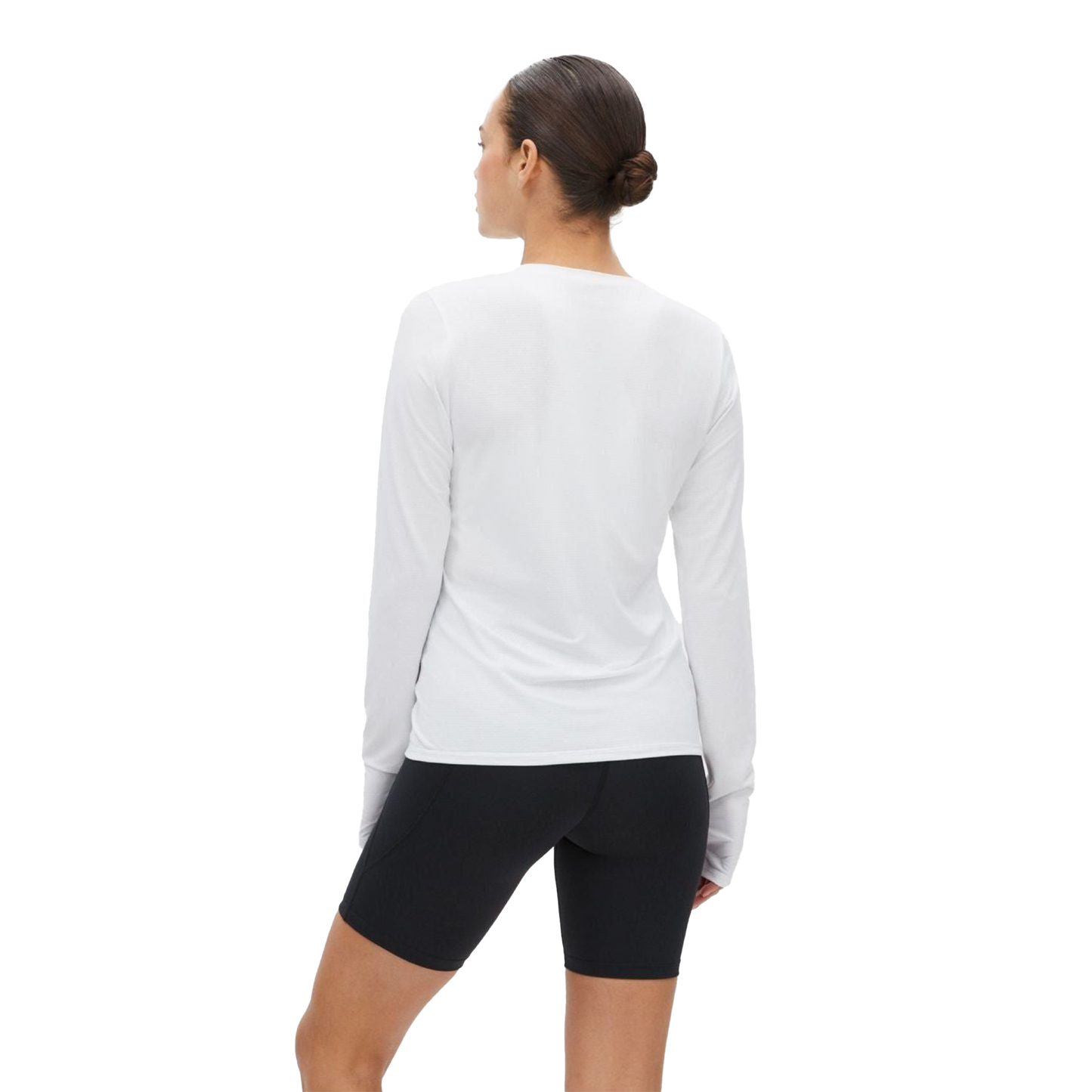 The individual is dressed in a moisture-wicking white Rohnisch Jacquard Long Sleeve and black shorts, facing away.