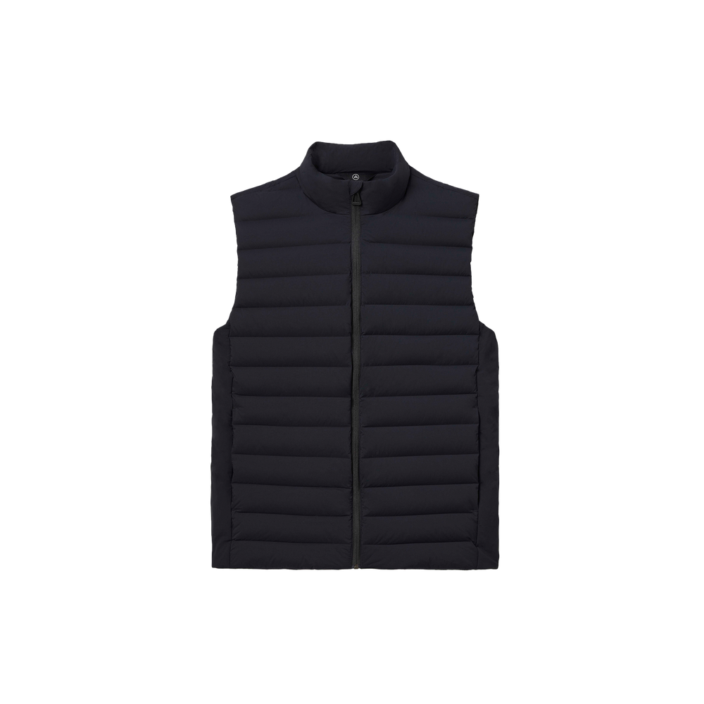 The Launch Vest by Aether is a black, lightweight sleeveless puffer vest that includes a front zipper and collar, providing insulated warmth and water-resistant protection.