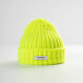 The Fluo Yellow Logo Beanie by Le Bonnet is made with durable, breathable lambswool Caregora. It features a folded brim and a front label displaying "Le Bonnet.