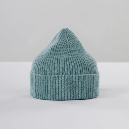 The basil-colored ribbed knit Beanie by Le Bonnet, made from soft lambswool with a pointed top, is shown against a plain background.