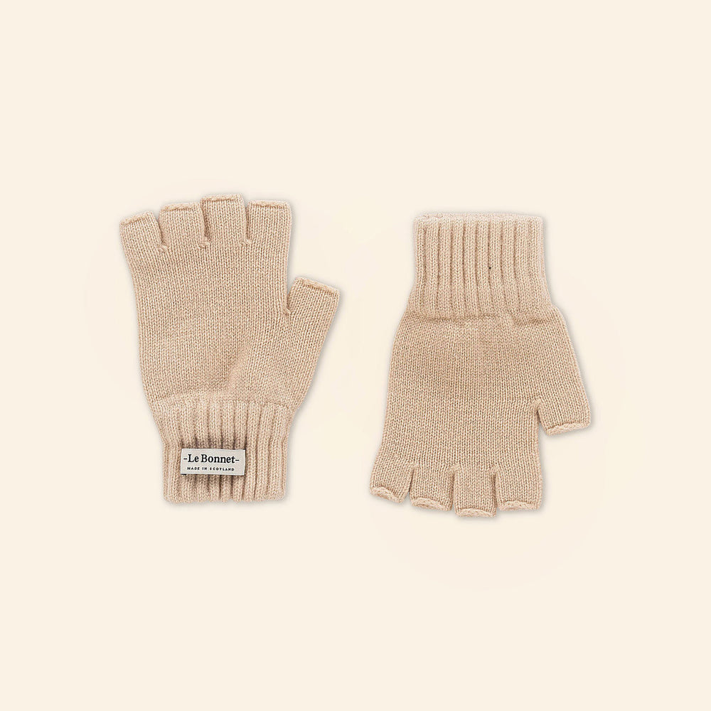 Sand-colored fingerless gloves by Le Bonnet, made from soft Merino wool, displayed on a neutral background. A "Le Bonnet" label on one glove highlights their quality and authentic Scottish craftsmanship.