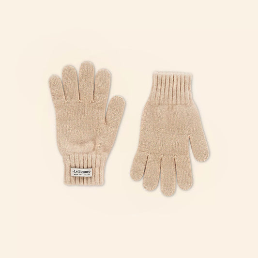 Two sand-colored knitted gloves made from luxurious Merino wool, ideal for cold weather, lie side by side on a neutral background. A "Le Bonnet" label adds an elegant touch to one glove.