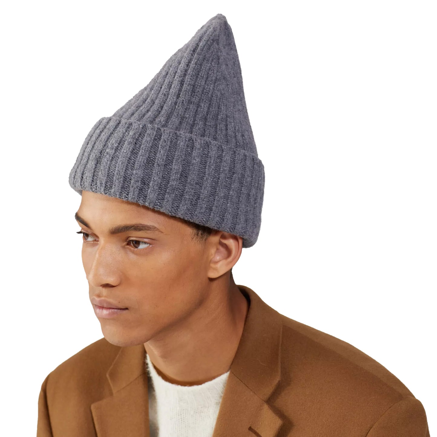 The person is cozy in a gray Large Beanie by Le Bonnet and a brown coat over a light sweater, perfect for chilly days.