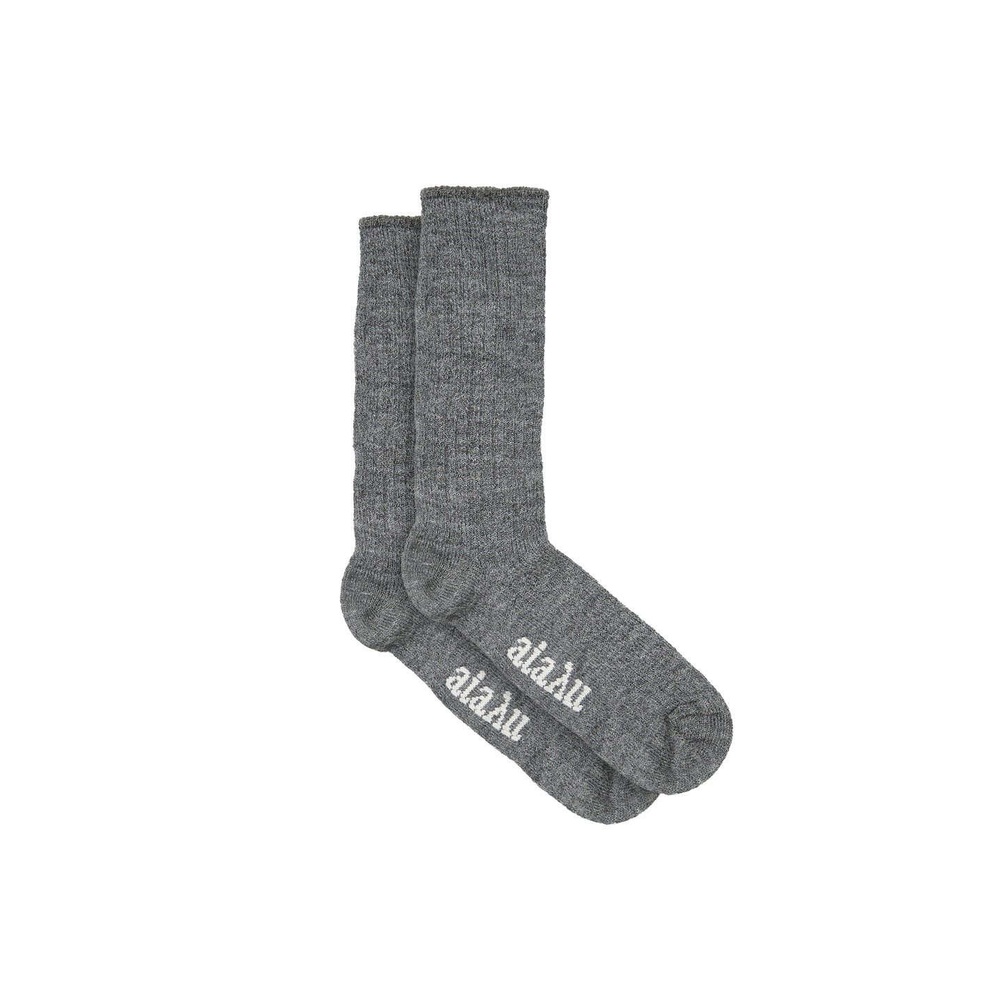 Aiayu's Llama Socks are gray crew socks made from thermoregulating llama wool, featuring "aläku" in white on the soles. Designed for comfort and style, they're perfectly unisex.