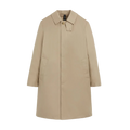 The M Manchester trench coat by Mackintosh, in beige, features a collar, button closure, and two front pockets, expertly demonstrating windproof outerwear against a plain white background.