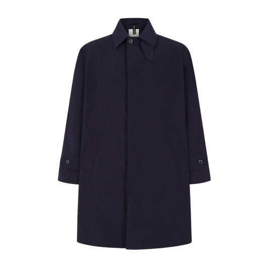 The Mackintosh M Nylon Soho coat in dark navy, a men's outerwear essential, features a collared neckline and buttoned cuffs, expertly crafted to be waterproof.