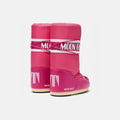 Pink Icon Nylon boots from Moon Boot with white text and laces, shown in side view on a plain background. These insulated shoes offer cozy comfort while adding a stylish edge.