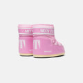 The Icon Low Nylon boots by Moon Boot, in pink with white soles, are showcased from the back against a simple backdrop.