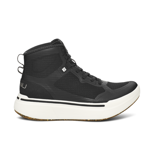 Introducing the M Sequence High by AHNU, a black mid-top sneaker with a white sole, adorned with black laces and subtle branding details on the side and tongue, enhanced with PEBA foam for exceptional comfort.