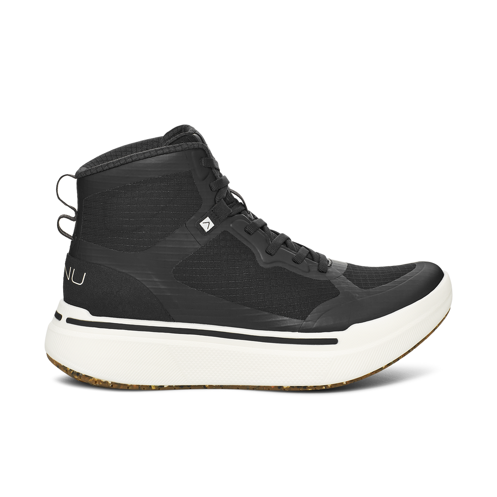 The AHNU W Sequence High, Black is a high-top athletic shoe with white soles and laces. It features a pull tab at the heel, a small logo on the side, and enhanced performance with a carbon plate for added stability.