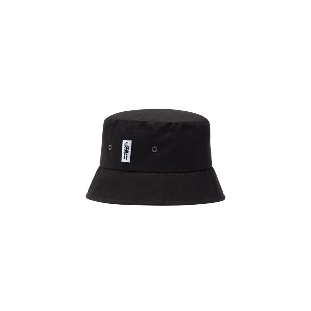 The Pelting Bucket Hat by Mackintosh is a black bucket hat made from dry wax cotton, featuring a small white rectangular label with a graphic symbol on the front. It offers both style and water-repellent functionality.