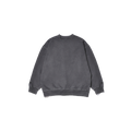 The Kappy Pigment Sweatshirt is a unisex crewneck with long sleeves, designed for a comfortable fit and made from pigment dyed cotton in a gray shade, set against a simple backdrop.