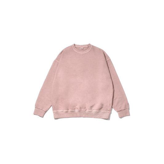 Introducing the Kappy Pigment Sweatshirt, a unisex garment in a subtle light pink hue. Made from pigment dyed cotton for exceptional comfort, it showcases a classic crew neck and long sleeves, set against an understated background.