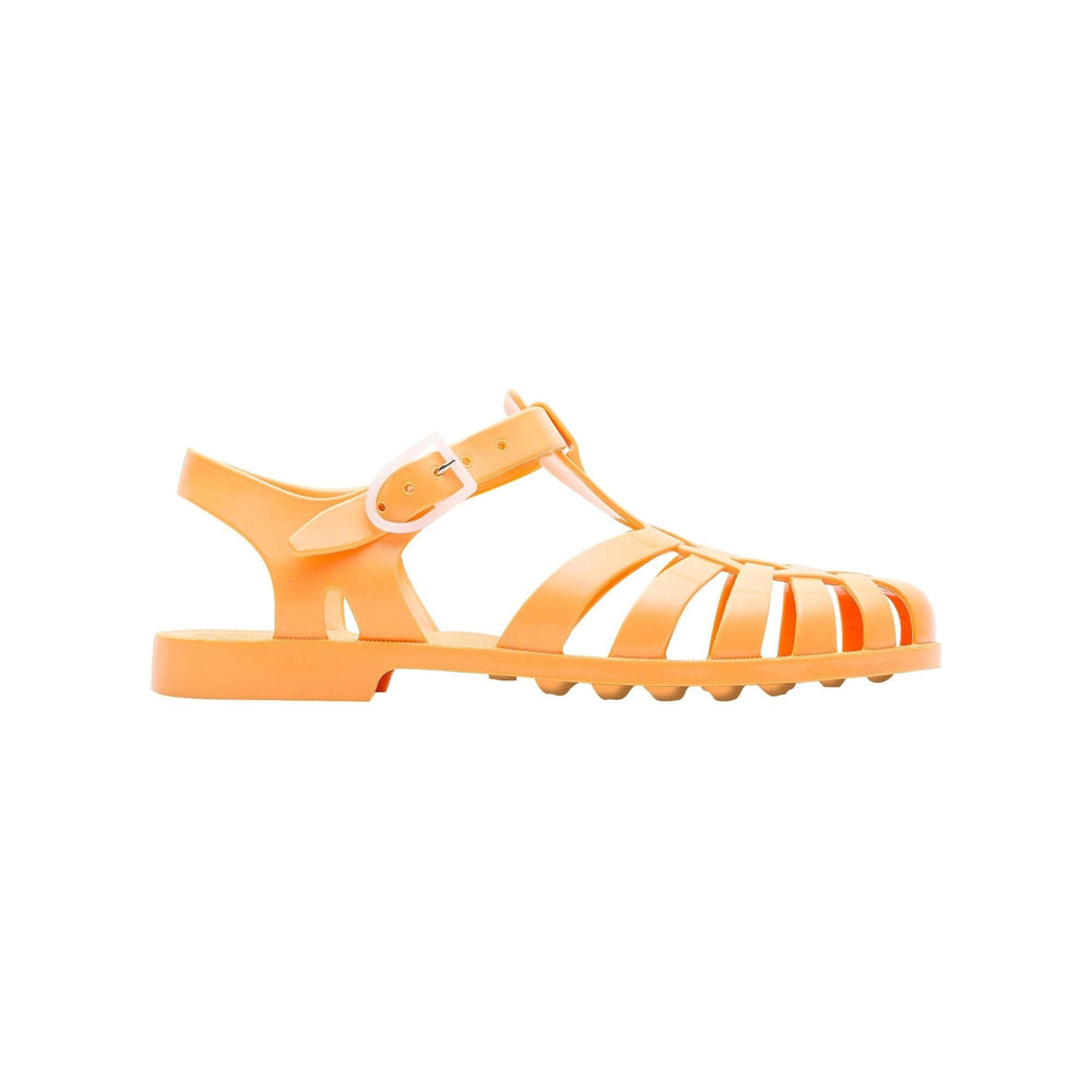 A single Sun Melon jelly sandal by Meduse with a closed toe, open sides, and an ankle strap, displayed on a white background.