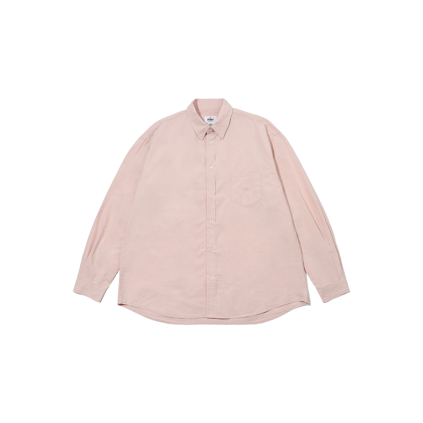 The Relaxed Cotton Shirt by Kappy is a light pink long-sleeve button-up made from soft cotton, showcasing a patch pocket on the front, set against a plain white background.