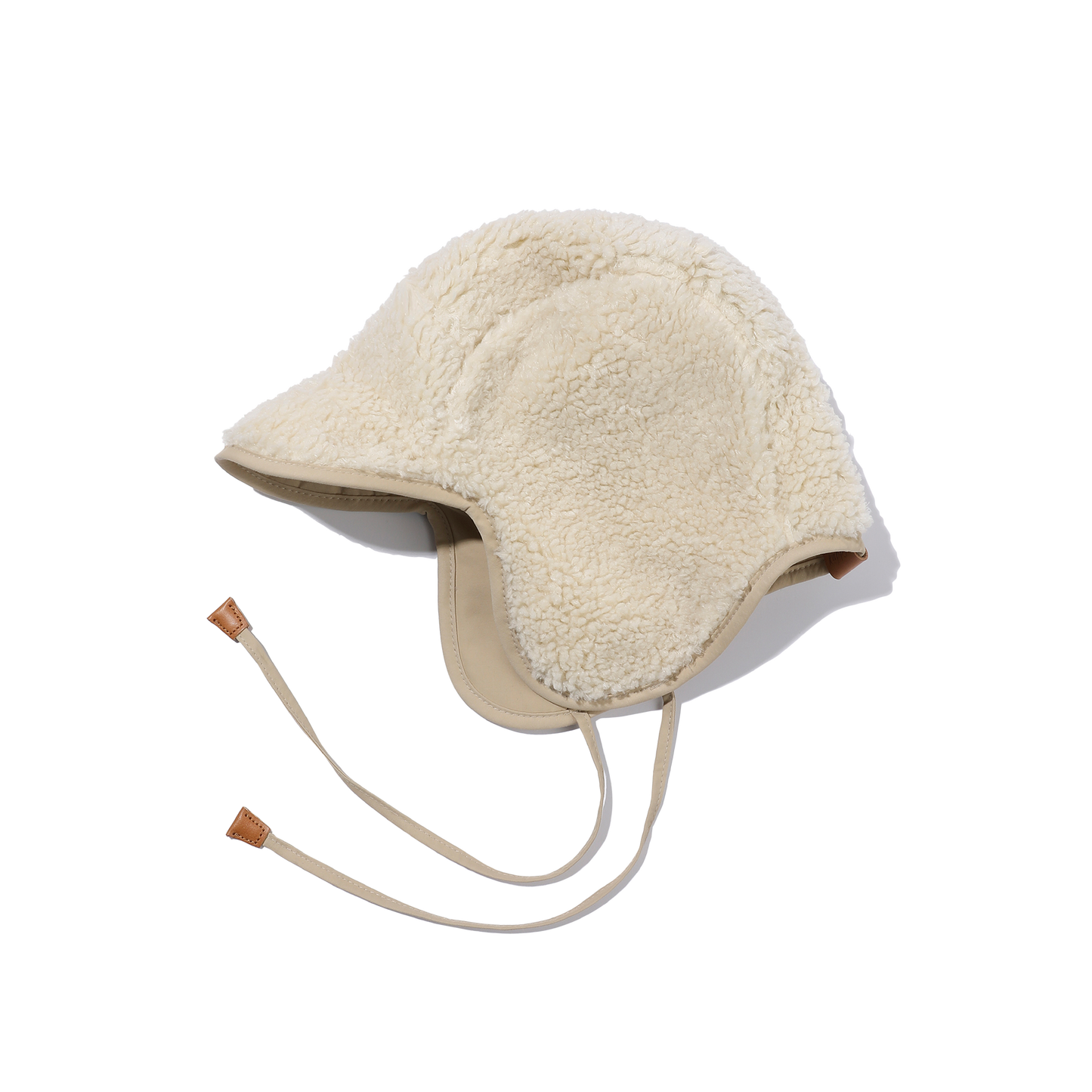 Against a white backdrop, the Reversible Trooper Hat by Kappy is elegantly displayed, featuring its classic cream-colored shearling design and chin straps, highlighting its gender-neutral charm.