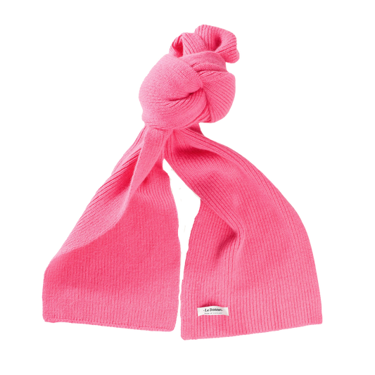 Le Bonnet bright pink ribbed knit lambswool scarf featuring a knot near the top, displayed on a plain white background.