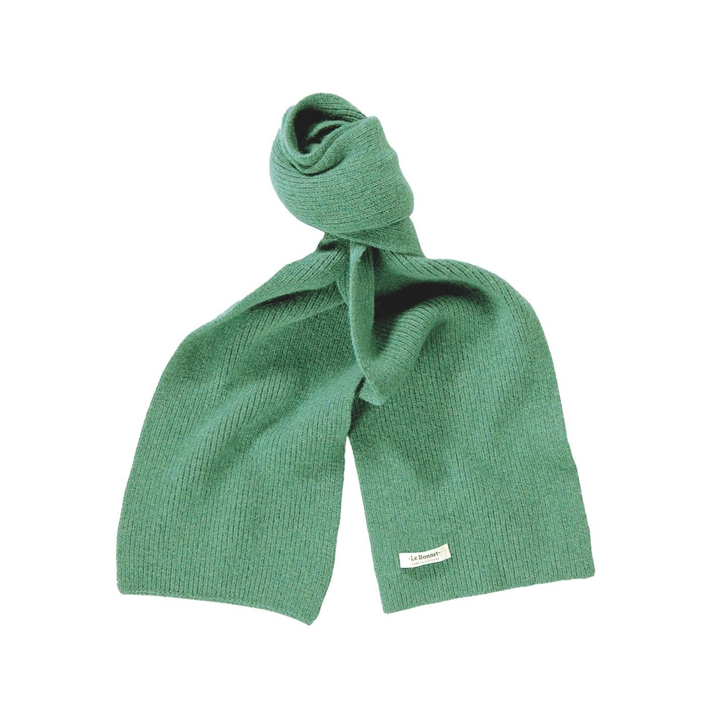 A green lambswool scarf by Le Bonnet, knitted and tied in a loose knot, with a small white label attached, handcrafted in Scotland.