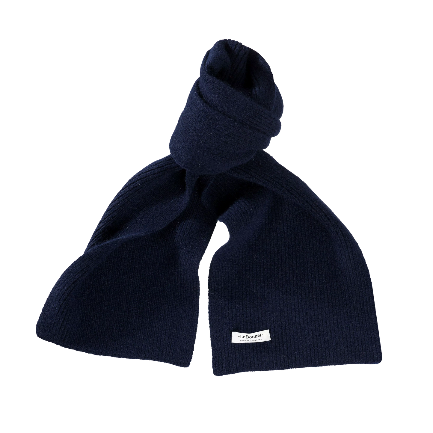 A navy blue lambswool scarf from Le Bonnet, knitted in Scotland and fully biodegradable.