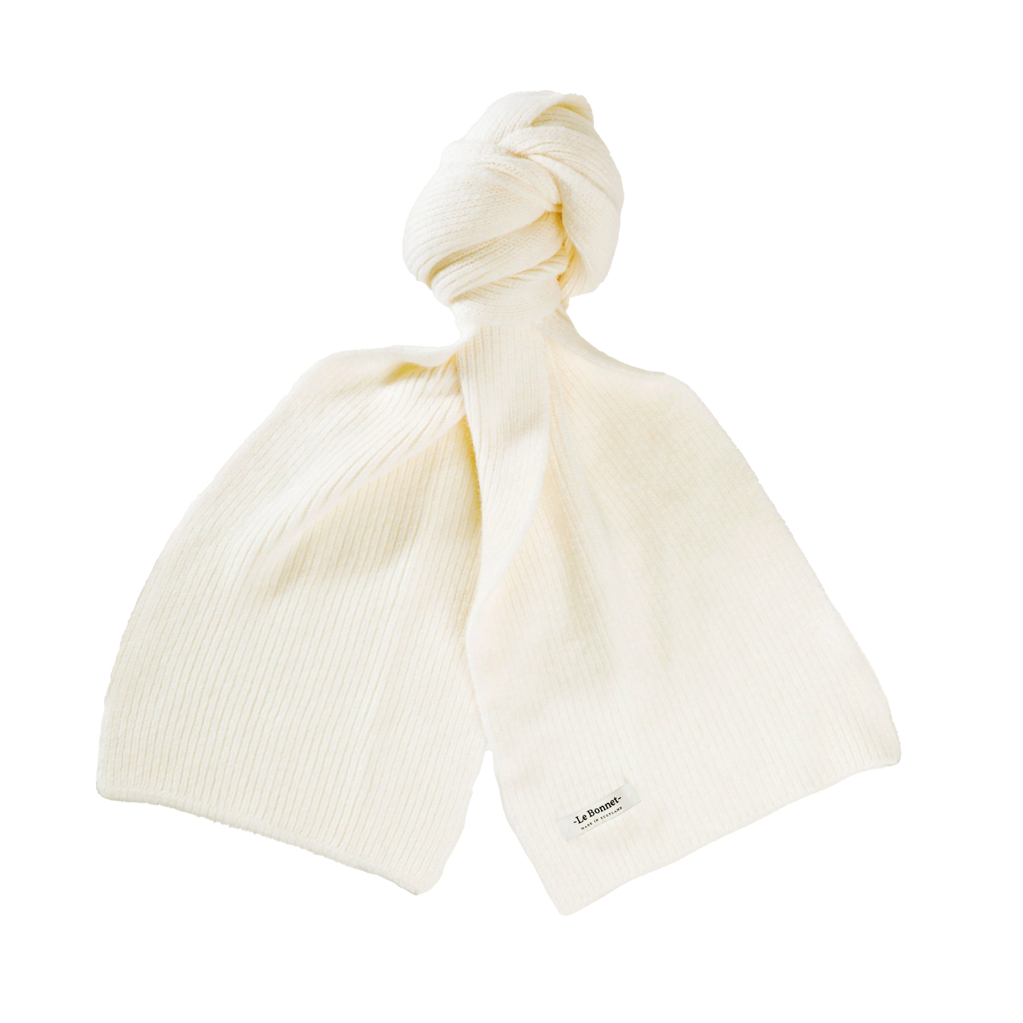 A cream-colored knitted scarf from Le Bonnet, crafted from 100% biodegradable lambswool, featuring a subtle ribbed pattern and knotted at the top.