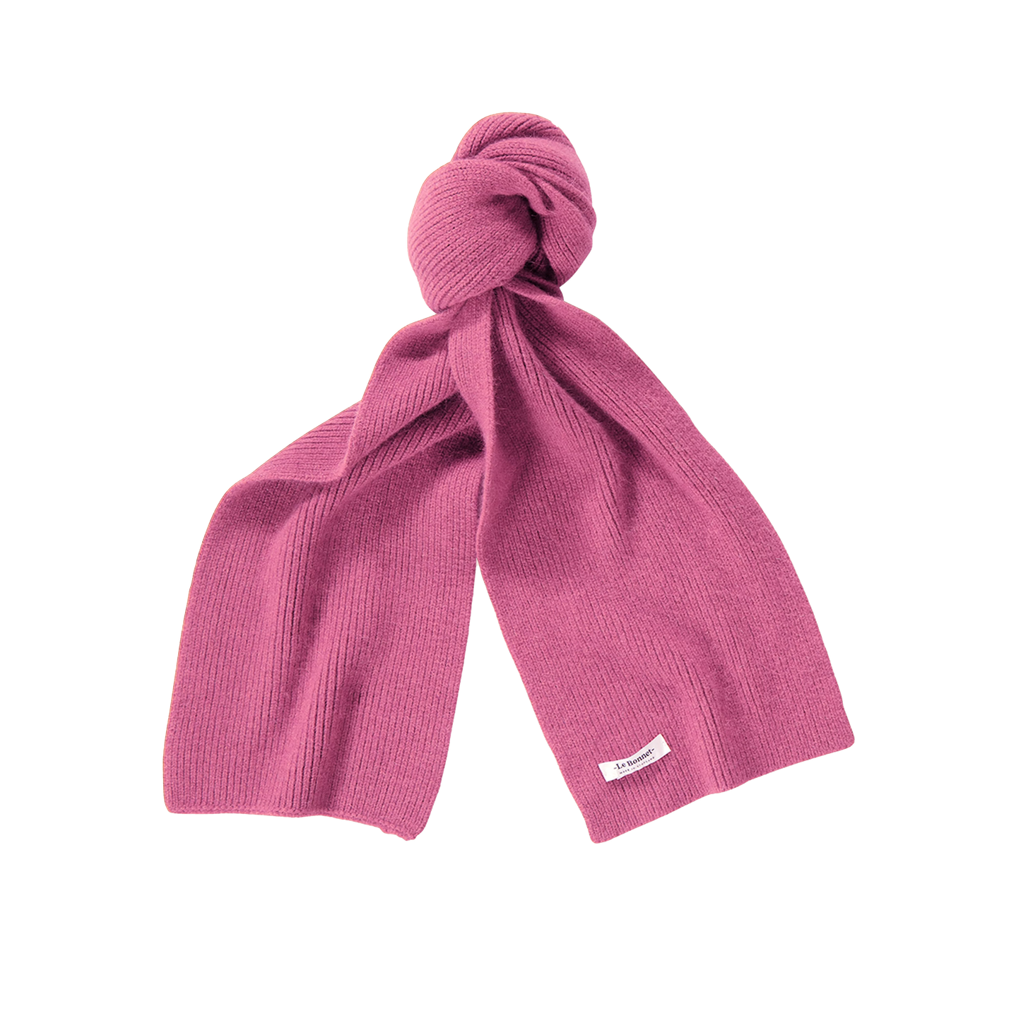 A biodegradable lambswool scarf from Le Bonnet, dyed a lovely pink, features a small white label and sits against a pristine white background. Tied in a loose knot at the top, this eco-friendly accessory combines sustainability with style.