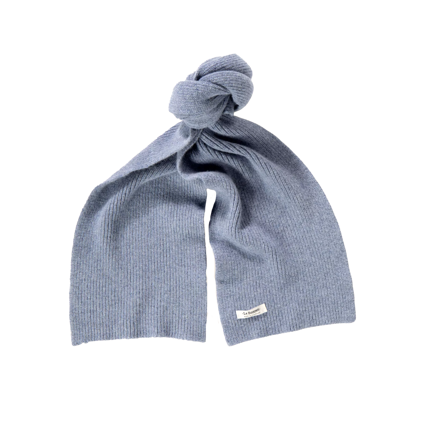 A neatly folded, light blue knitted Lambswool scarf from Le Bonnet is tied in a knot with a small white label attached.