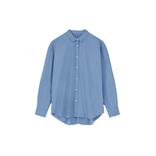 The Classic Chetna Cotton Shirt by Aiayu, designed in light blue and made from GOTS-certified organic cotton, showcases long sleeves and a classic collar. Set against a plain white background, this shirt merges timeless style with eco-friendly charm.