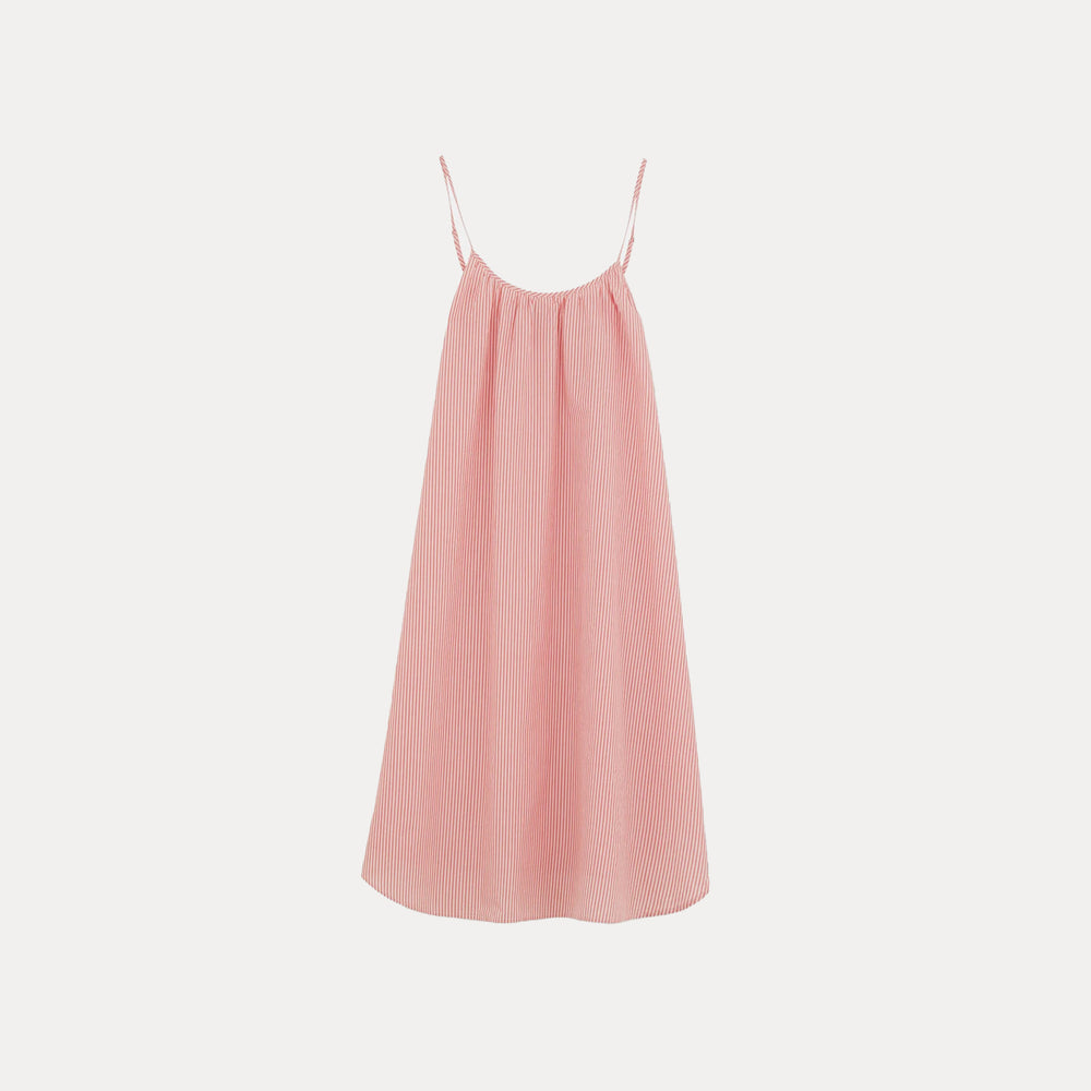 The Aiayu Strap Dress Petite, a pink and white striped sleeveless gown with thin spaghetti straps, beautifully complements your sleepwear collection as it hangs gracefully against a plain white backdrop.