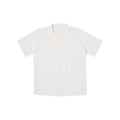 A white Camp Shirt from Universal Works, featuring a relaxed fit with short sleeves and an open collar, is displayed laid flat on a white background.