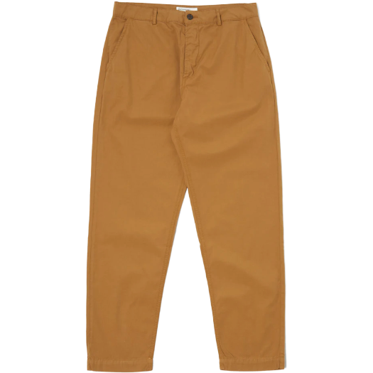 A pair of cumin-colored Military Chino pants from Universal Works, featuring a straight-leg design with button and zipper closure, front pockets, and a belt loop waistband. These great-fitting trousers are the epitome of contemporary classic style.