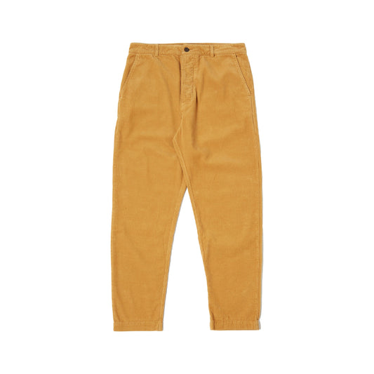 Universal Works' Military Chino Corduroy in Corn features a relaxed fit with front button and zipper, mid-rise design, and two side pockets, making these military-inspired trousers perfect for any casual outing.