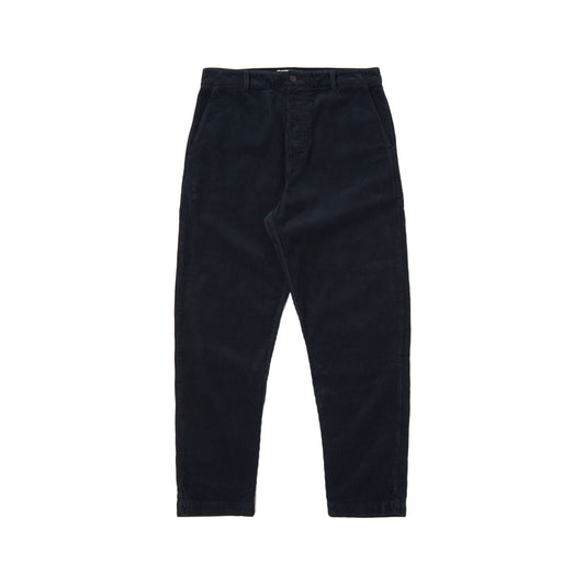 Universal Works' Military Chino Corduroy trousers in navy feature a button and zipper closure, front and back pockets, and are depicted on a plain white background. These loose fit chinos deliver both comfort and style for any event.