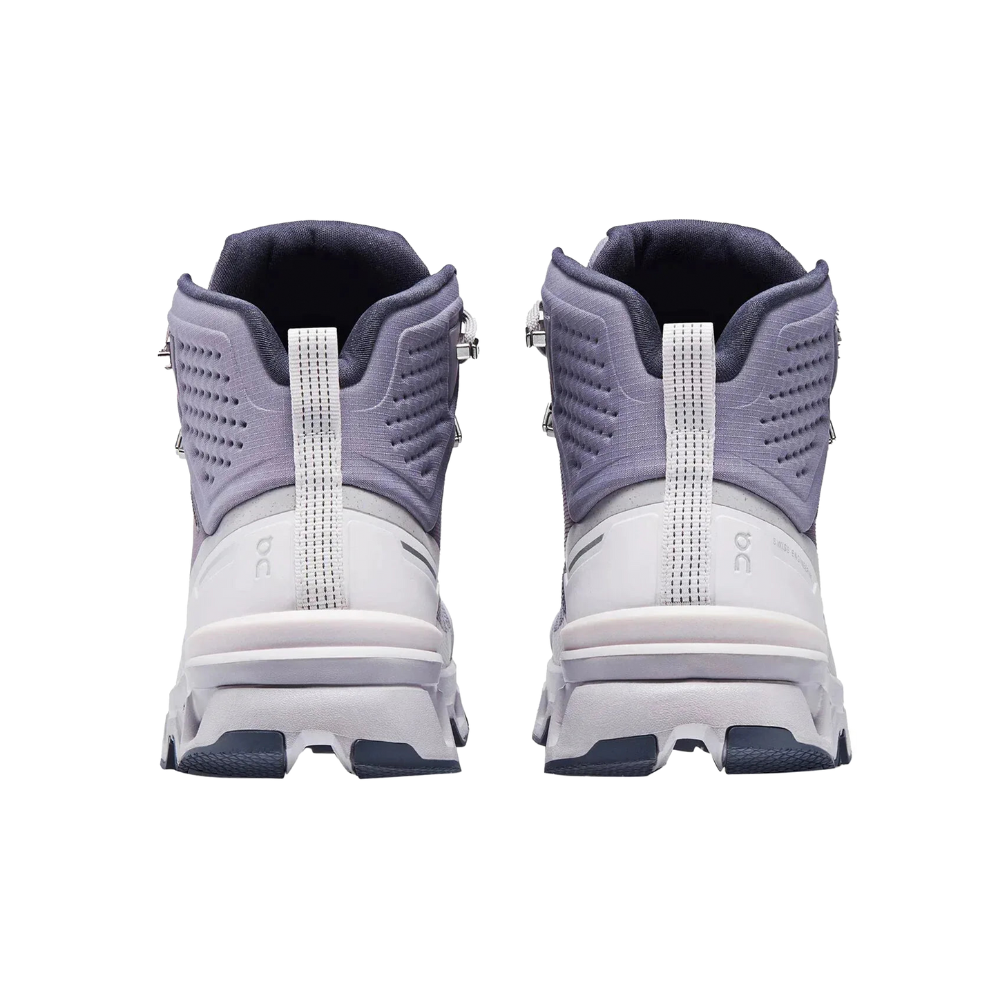 Rear view of the Women's Cloudrock 2 Waterproof boots by On Running, showcasing a waterproof white and gray design with textured soles and an ankle-height style, ideal for speed-hiking enthusiasts.