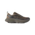 Side view of the Hoka Stealth/Tech Bondi 8 Caged athletic shoe in olive green, featuring a thick, textured sole and sleek design.