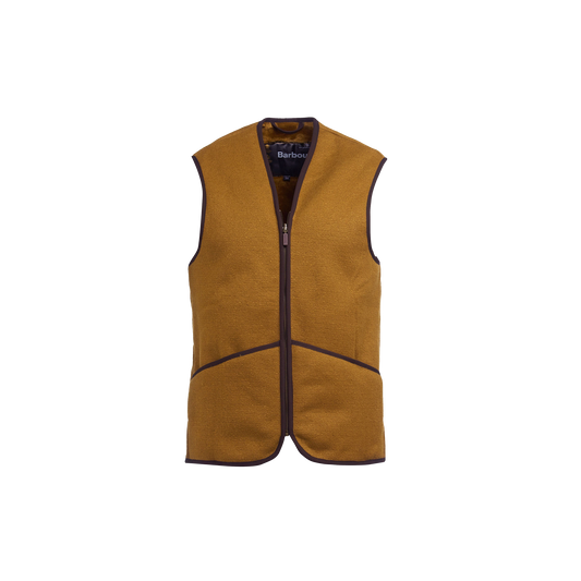 The Barbour M Warm Pile Waistcoat Zip-In Liner is a sleeveless brown fleece vest with a front zipper and dark brown trim, designed to be a versatile addition to Barbour jackets. It prominently features the iconic "Barbour" label inside.