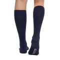 A person wears Aiayu's Wool Knee Socks in navy blue, featuring white text on one heel. These durable knit socks offer long-lasting comfort.