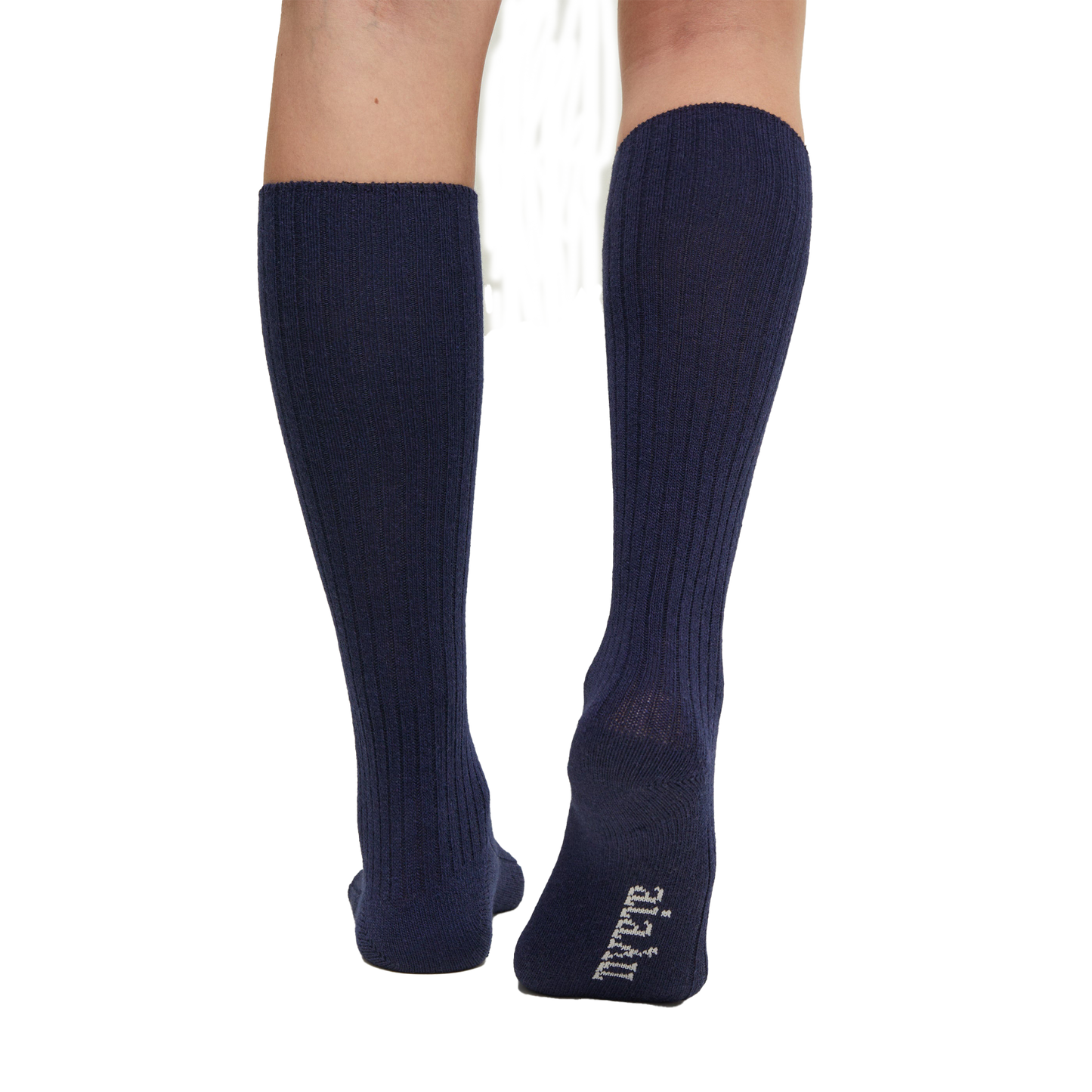 A person wears Aiayu's Wool Knee Socks in navy blue, featuring white text on one heel. These durable knit socks offer long-lasting comfort.